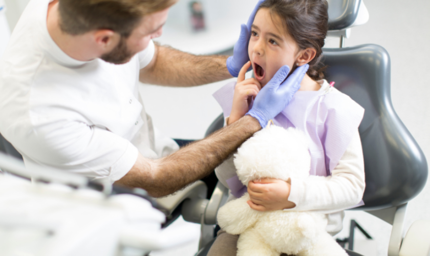 Child visiting dentist in Sparkill NY for summer dental checkup and preventive care